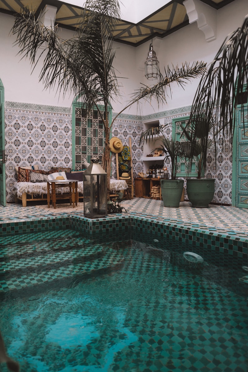 ground pool near wooden lounges, marrakech