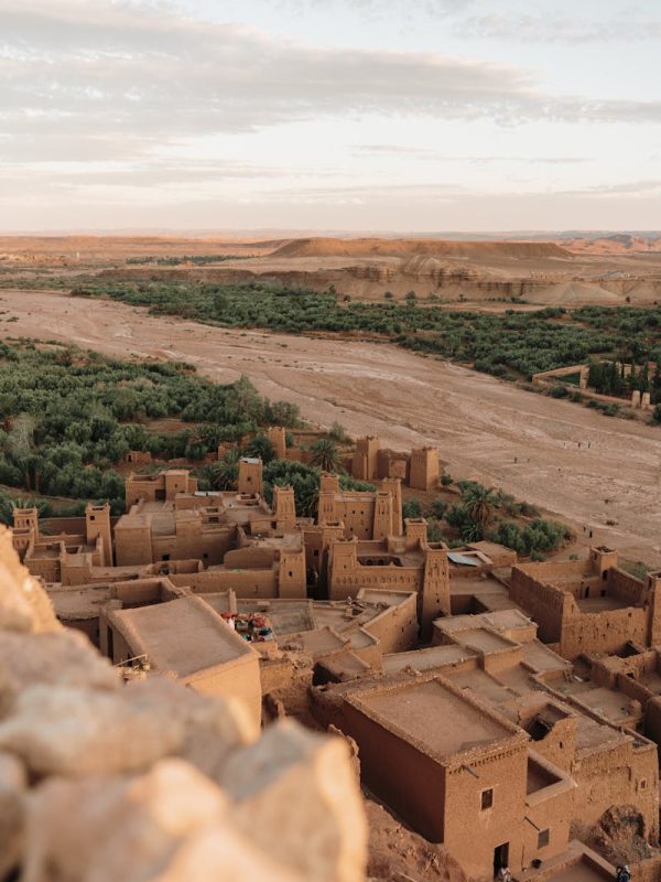 10 Day Morocco Tour From Casablanca 15 Stunning aerial shot of Ouarzazate's ancient Kasbah in Morocco's arid landscape.