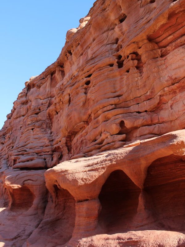 Discover Morocco 3 Days Marrakech To Fes Magic 4 Breathtaking view of red sandstone formations sculpted by nature, under a clear blue sky.