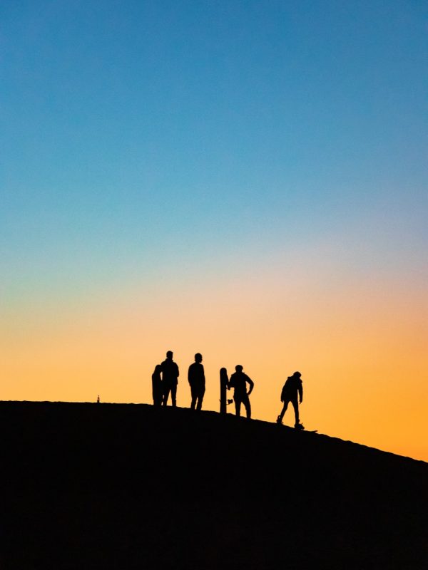 4 Days Tour From Marrakech To Fes 5 silhouette photography of four people holding snowboards