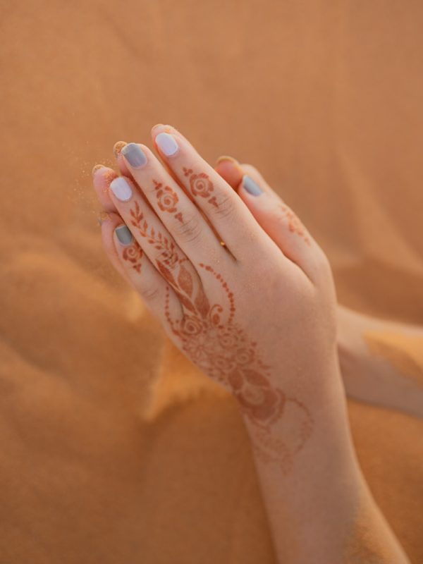 Errachidia to Merzouga: Experience the Desert Magic in 2 Day 2 person with white floral tattoo on left hand,Errachidia to Merzouga