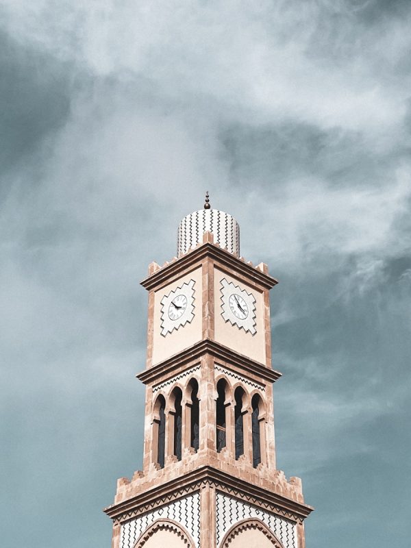 10 Day Morocco Tour From Casablanca 1 a clock tower with a cloudy sky in the background,10-day Morocco tour from Casablanca