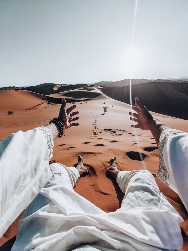 3-Days Marrakech to Merzouga Dunes Desert Tour with Camel Trek 6 person in blue denim jeans lying on sand during daytime